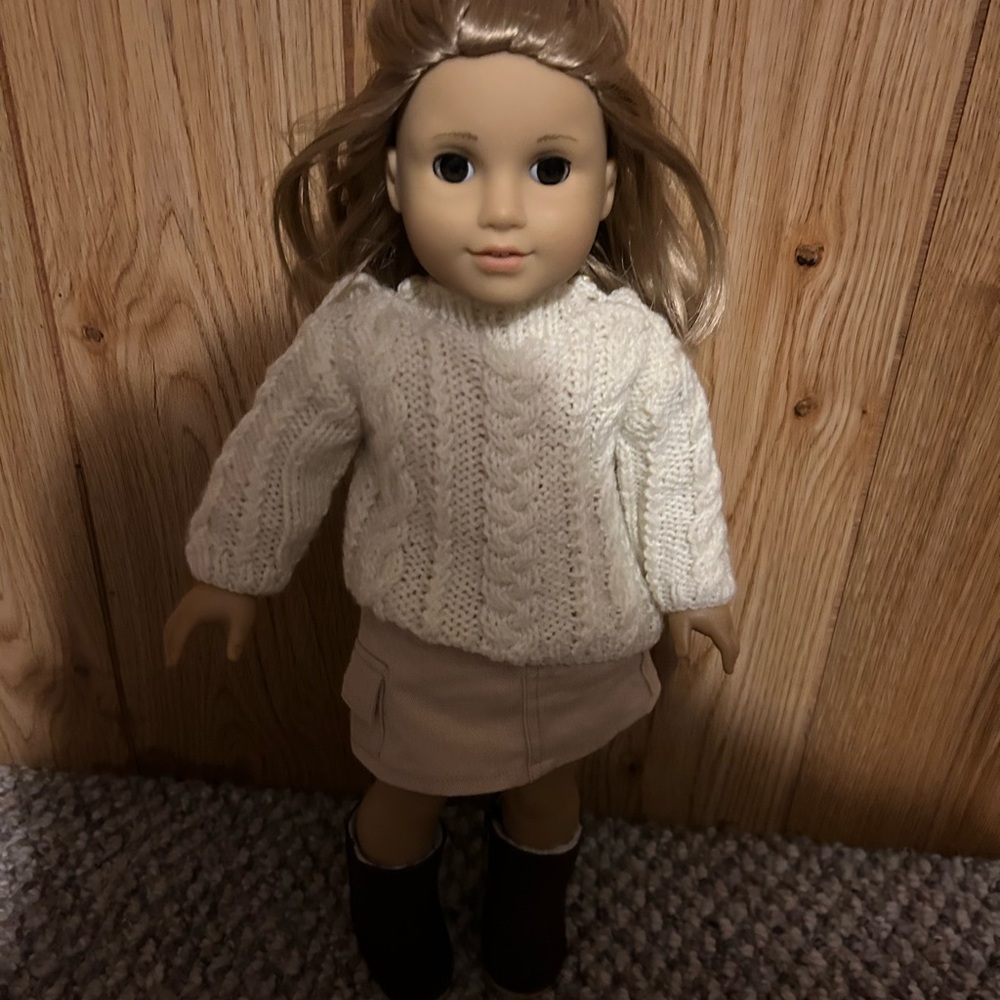 American Girl Doll of Today  with White Sweater and Tan Skirt.